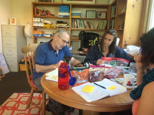 Red Tomato team review produce packages.